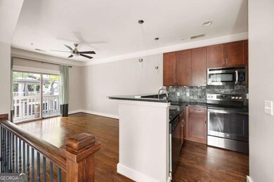 Kitchen features stainless steel appliances.