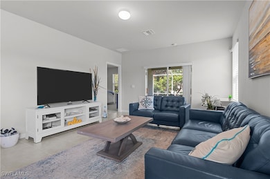 Living room with light tile patterned floors