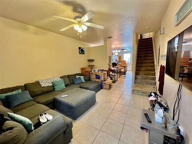 Spacious living roomwith ceramic tile floors