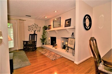 LARGE FIREPLACE ACCENTS THE LIVING ROOM