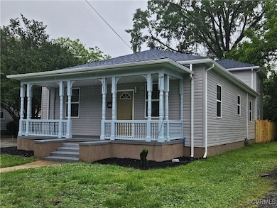 View of front of home with covered porch and a shi