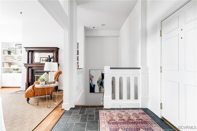 Hallway with dark hardwood / wood-style flooring