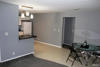 Dining space featuring baseboards and carpet floors