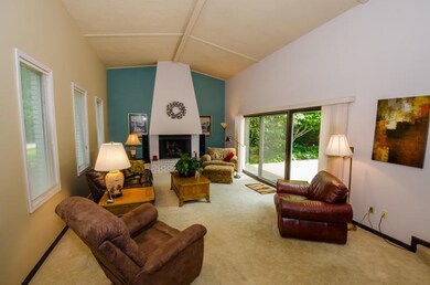 Cathedral ceilings, gas log fireplace, and sliders