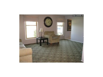 Living room (18x12)... Off the foyer. Neutral tan 