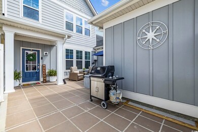Doorway to property featuring a patio