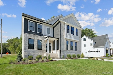 View of front facade featuring a garage and a fron