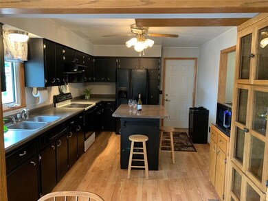 Built-ins in kitchen, wood floors & garage entranc
