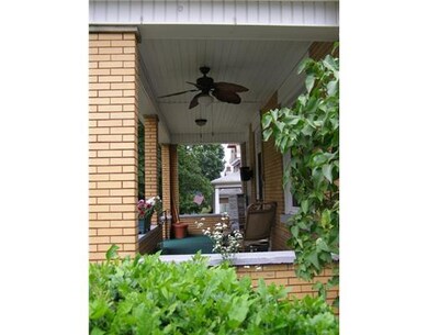 Exterior Front. Front porch with ceiling fan.