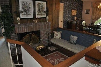 Cozy conversation pit with brick fireplace