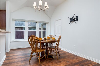 Kitchen nook area with wall of windows, vaulted ce