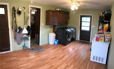 Laundry/mud room, plenty of storage. Exit to front
