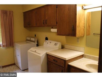 Main Floor Laundry room with appliances and sink.