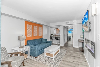 Living room featuring baseboards, visible vents, a