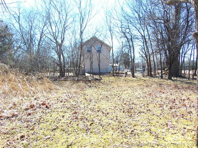 Side view of the fenced in yard around the home.