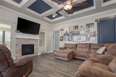 Stone Fireplace and Coffered Ceiling
