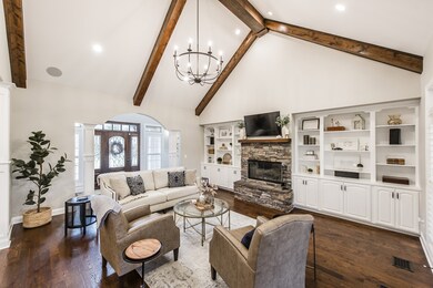 There's a wood burning fireplace with stone hearth and lovely built in shelving!