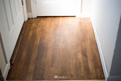 Original hardwood entry-original hardwoods under wall to wall carpet.