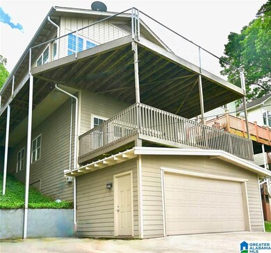 3-stories, all daylight, main-level parking pad wi