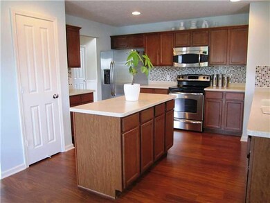 Exterior Front. View of the pantry.  Stainless range and microwave are included.
