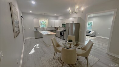 Dining room with sink, light hardwood / wood-style