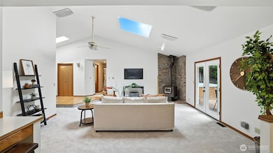 This living space offers the perfect amount of comfort for all PNW weather. With a wood burning stove for true winter comfort