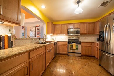 Kitchen with appliances with stainless steel fini