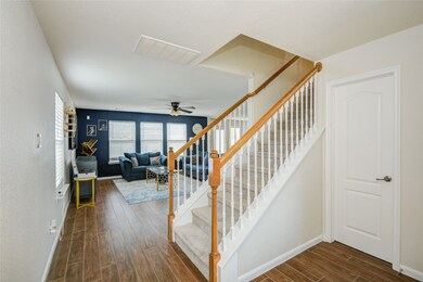 From the foyer, you’re greeted by the open stairca