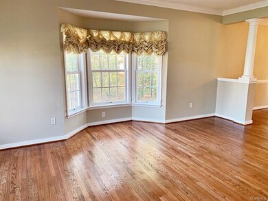 The Formal Living Room is accentuated with Hardwoo