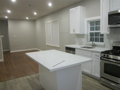 Kitchen with granite counter top and Breakfast Cou