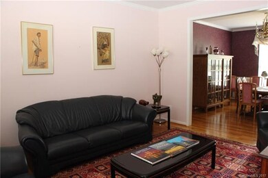 The formal living space opens to the formal dining
