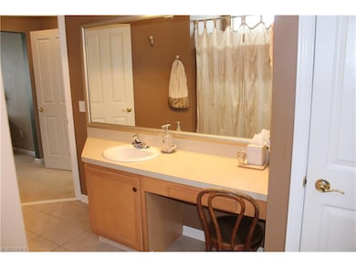 Master bath with tiled flooring ,shower and makeup