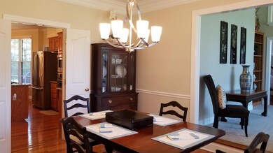 Dining opens to living room and kitchen