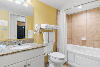 Full bathroom featuring tile patterned flooring, t