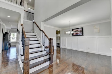 Staircase featuring a decorative wall, ornamental 