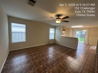 Unfurnished room with a ceiling fan and baseboards