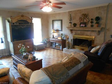 Living room features a wet bar and a gas log fireplace