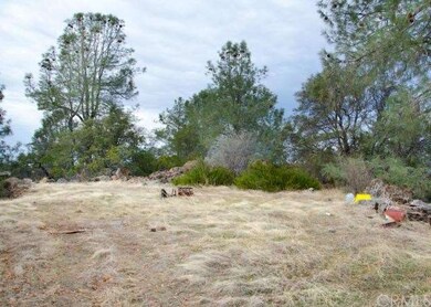 Level home site nestled among rock outcroppings.