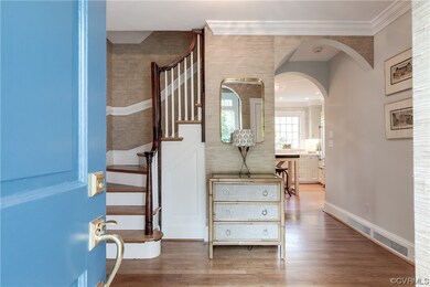 Enter into a center foyer with lovely oak floors.