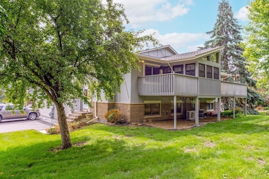 Expansive green space surrounds the home, with mature trees providing natural shade and a sense of privacy—perfect for outdoor relaxation.