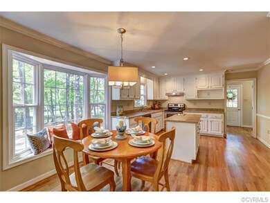 Eat-in kitchen with bay window and new hardwood fl