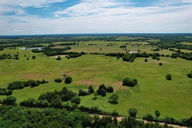 Birds eye view of property with a rural view