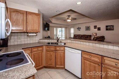 Kitchen w/ Granite countertops and tile backsplash