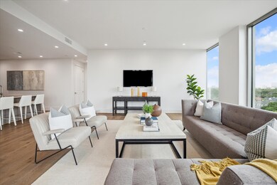 The open-concept layout is perfect for both entertaining and everyday living. Photos are of a similar unit with the same floor plan