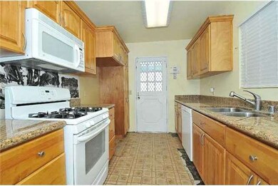 The kitchen includes granite countertops and lots 
