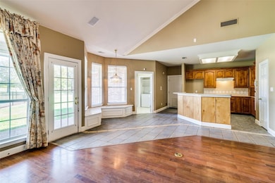 Kitchen with light tile patterned flooring, visibl