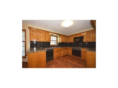 Granite, beautiful tile, plank flooring & space fo
