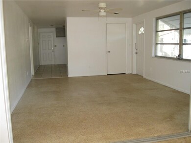 Living Room looking toward kitchen and carport ent