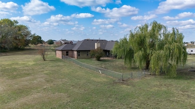 Back of house with a fenced backyard, a patio, and a shingled roof