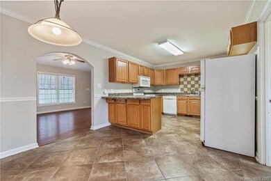 An eat -in kitchen that is conventialy located nex